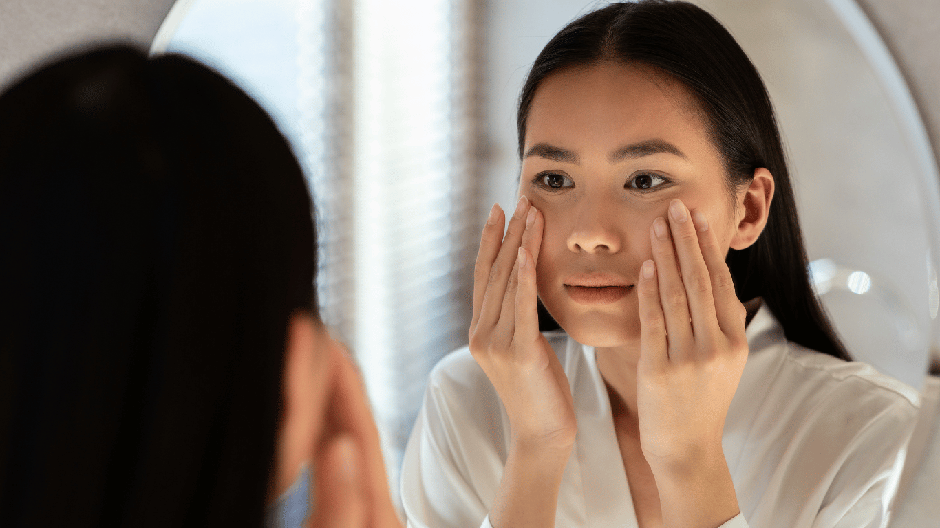 A millenial woman demonstrates how to tell if you have oily or dry skin