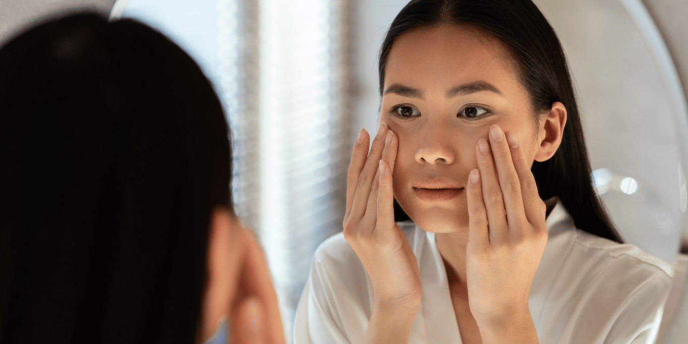 A millenial woman demonstrates how to tell if you have oily or dry skin