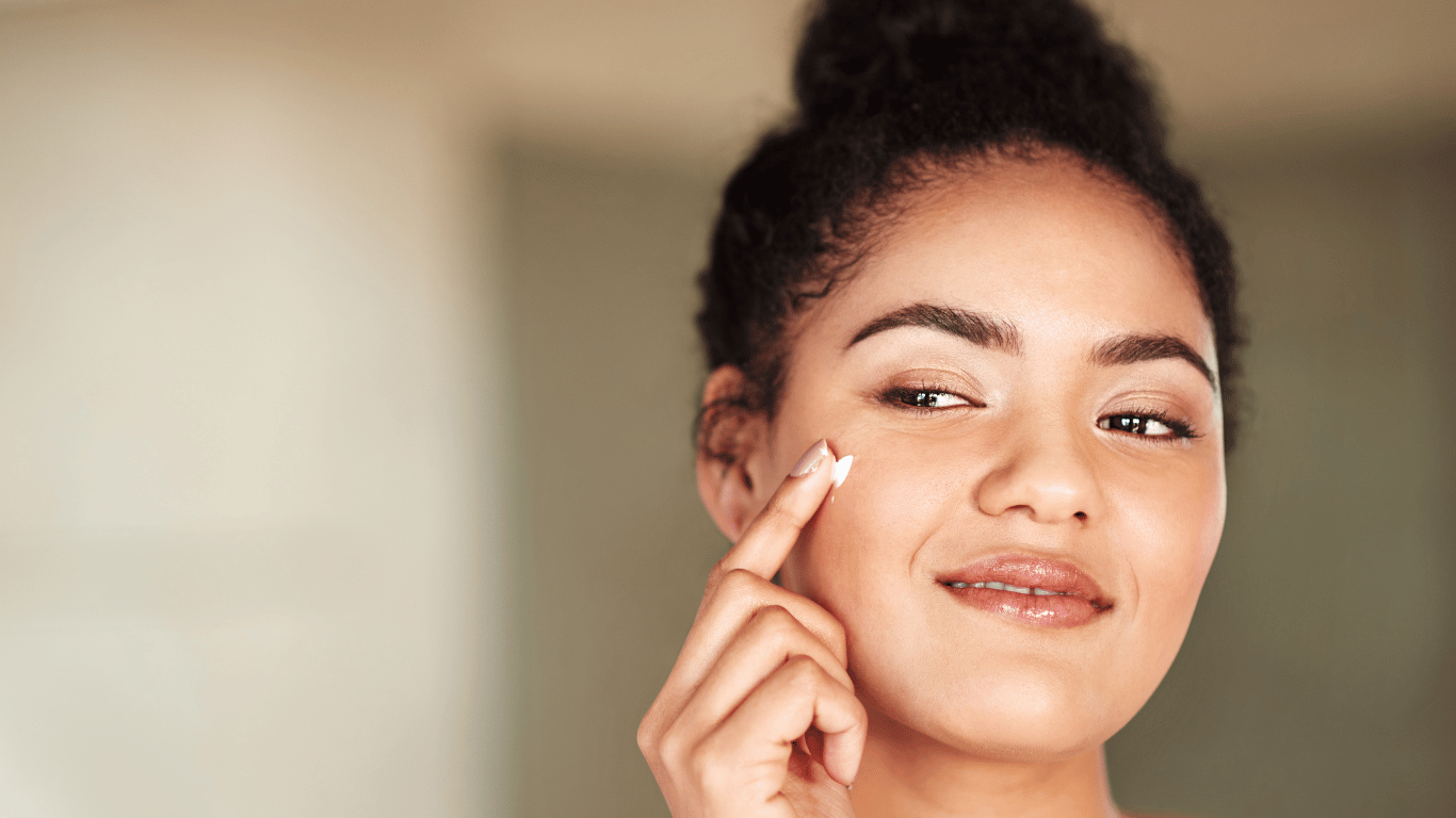 A millenial woman demonstrates when to use toner in a skincare routine