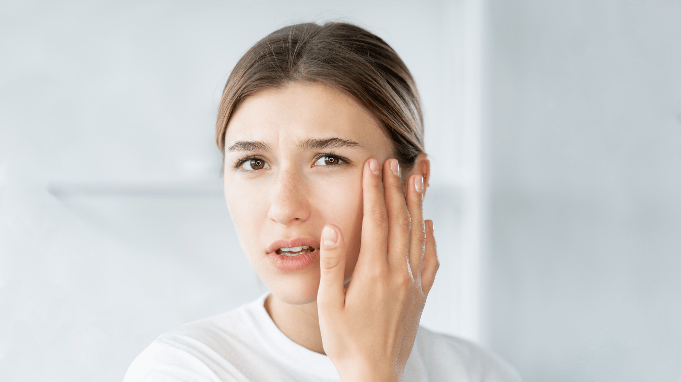 A millenial woman is wondering how to cure dry skin around eyes