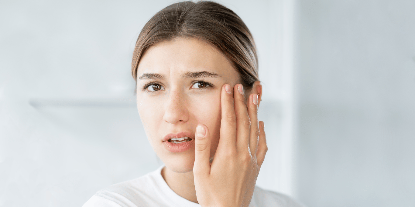 A millenial woman is wondering how to cure dry skin around eyes