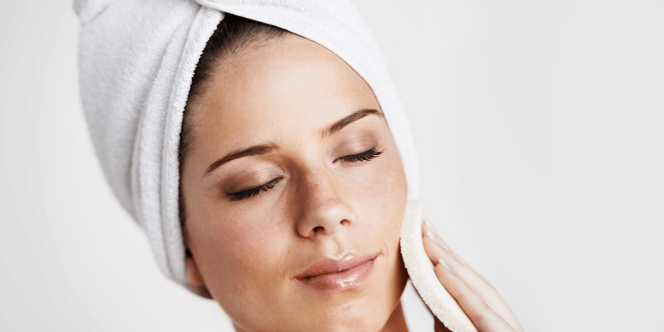 A millenial woman demonstrates how to exfoliate sensitive skin