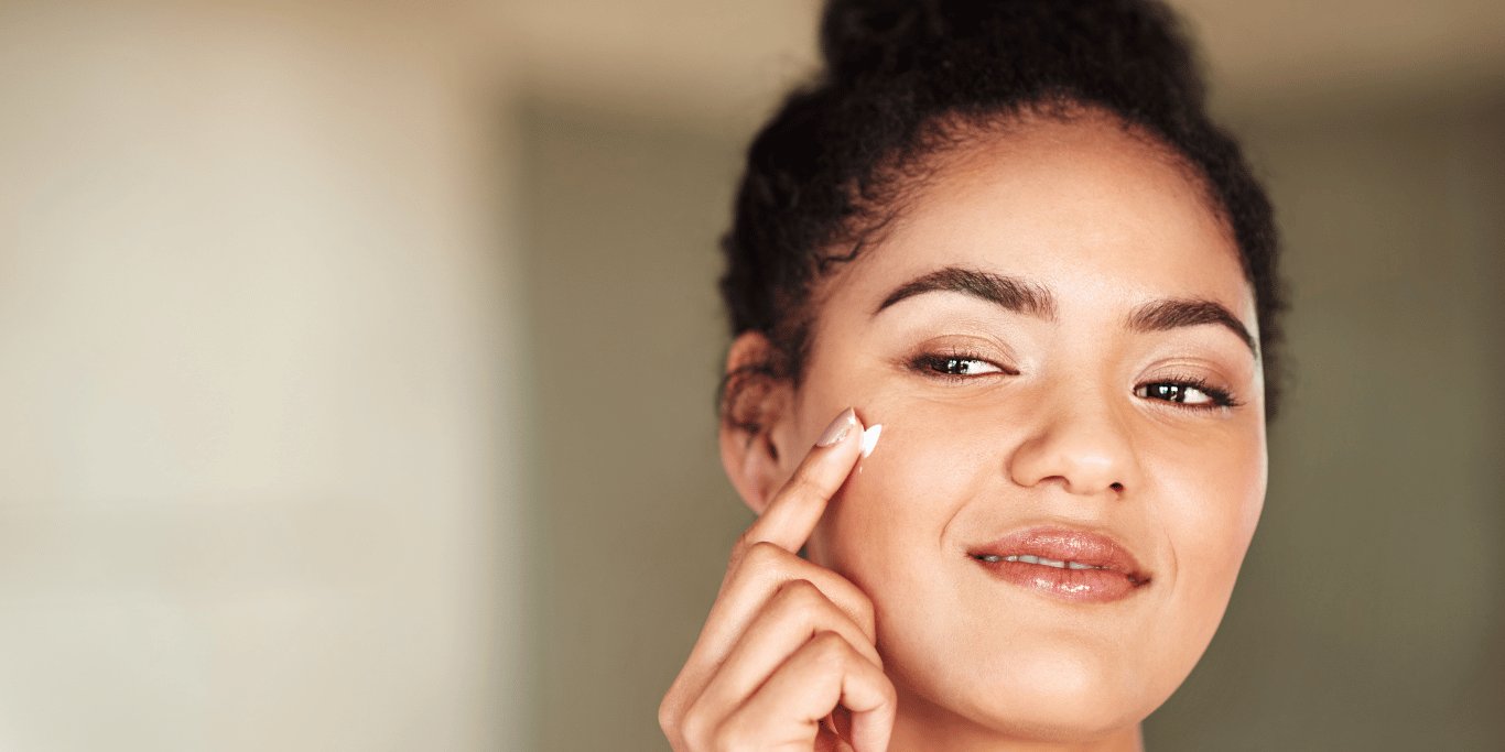 A millenial woman demonstrates when to use toner in a skincare routine